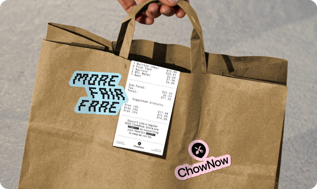 A paper takeout bag with a receipt and two stickers attached