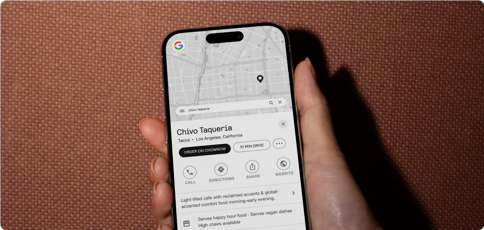 Person searching for a restaurant on Google using a phone