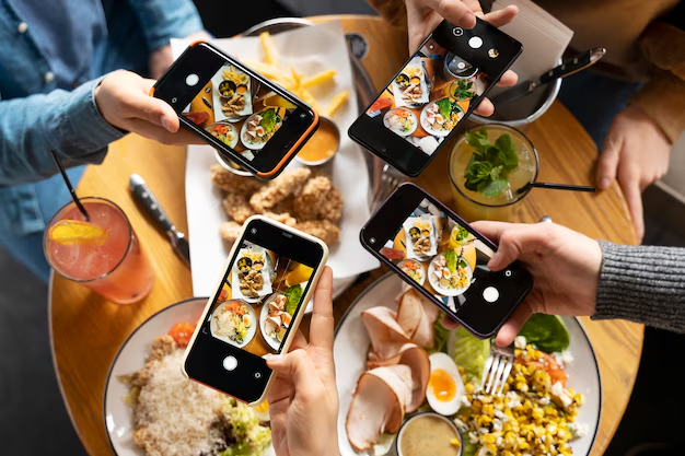 Overhead shot of people taking photos of their food