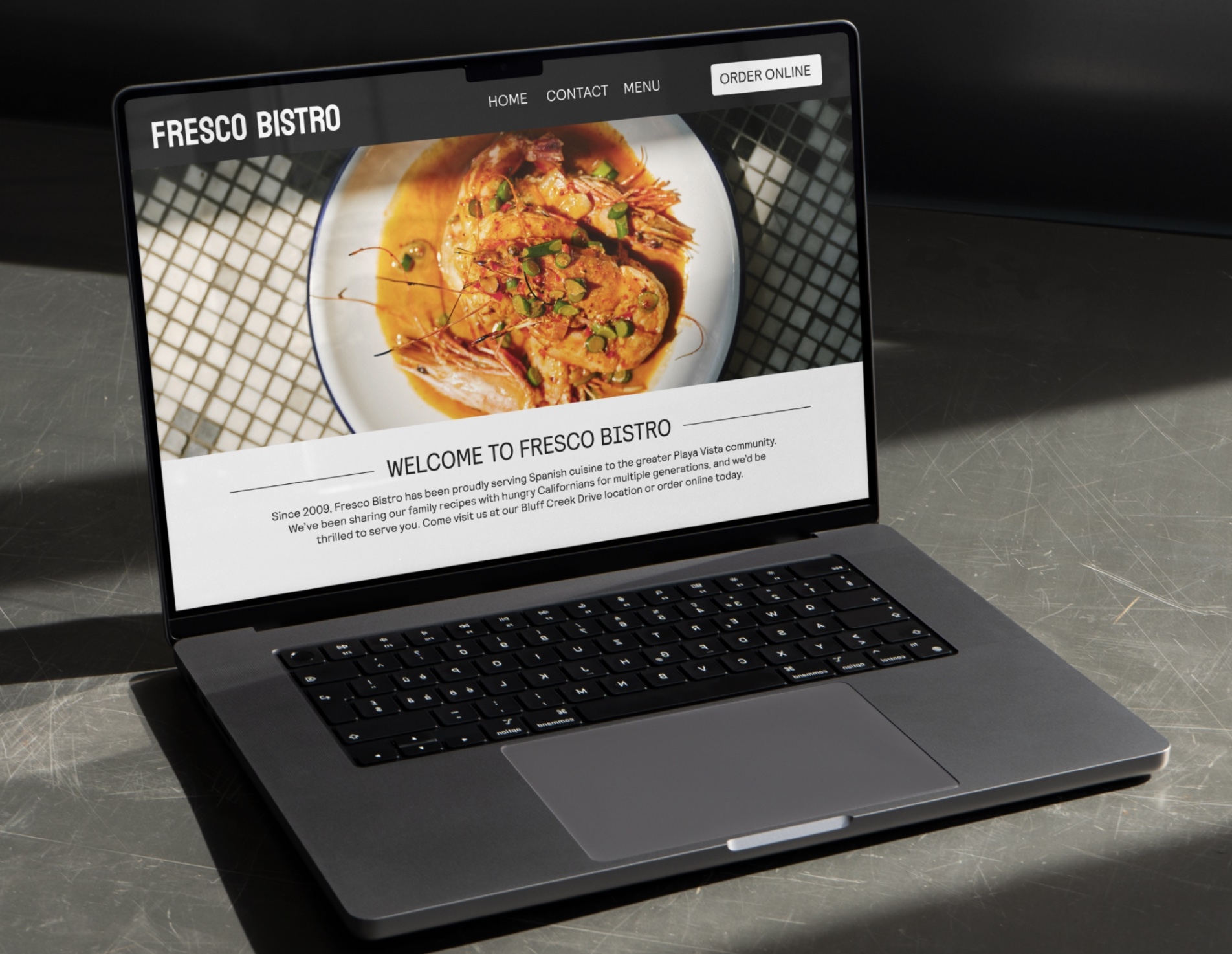 photo of restaurant website open on laptop