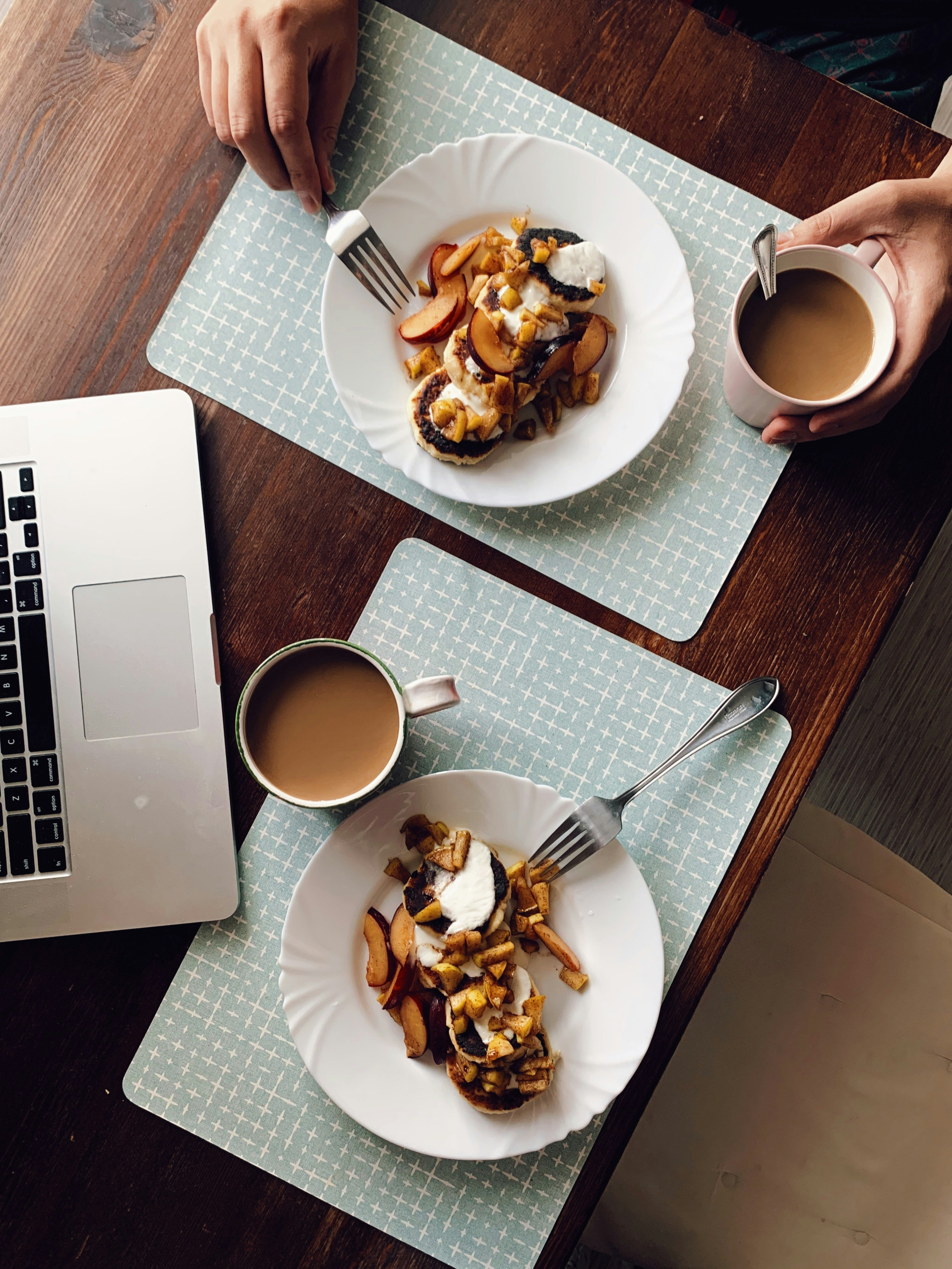 overhead shot of restaurant food and laptop