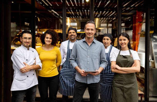 restaurant staff standing together with manager