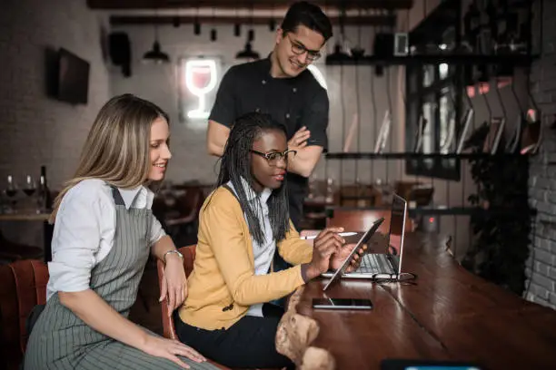 restaurant staff using tablet