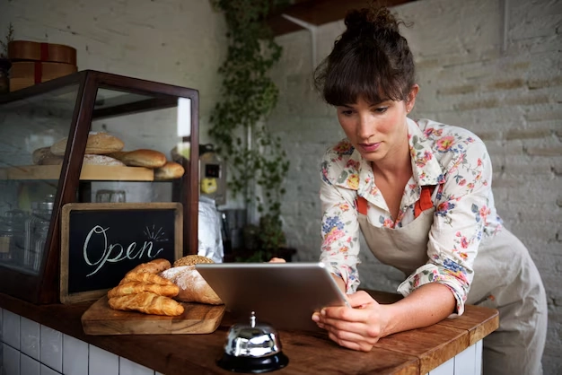 server at cafe holding tablet