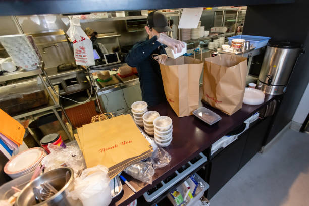 restaurant staff packing takeout orders