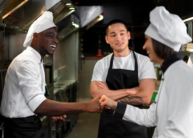 two chefs shaking hands