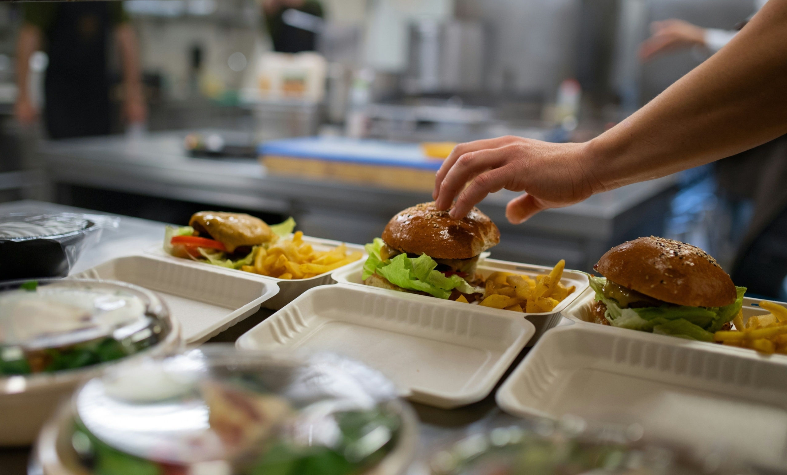takeout burgers being prepared