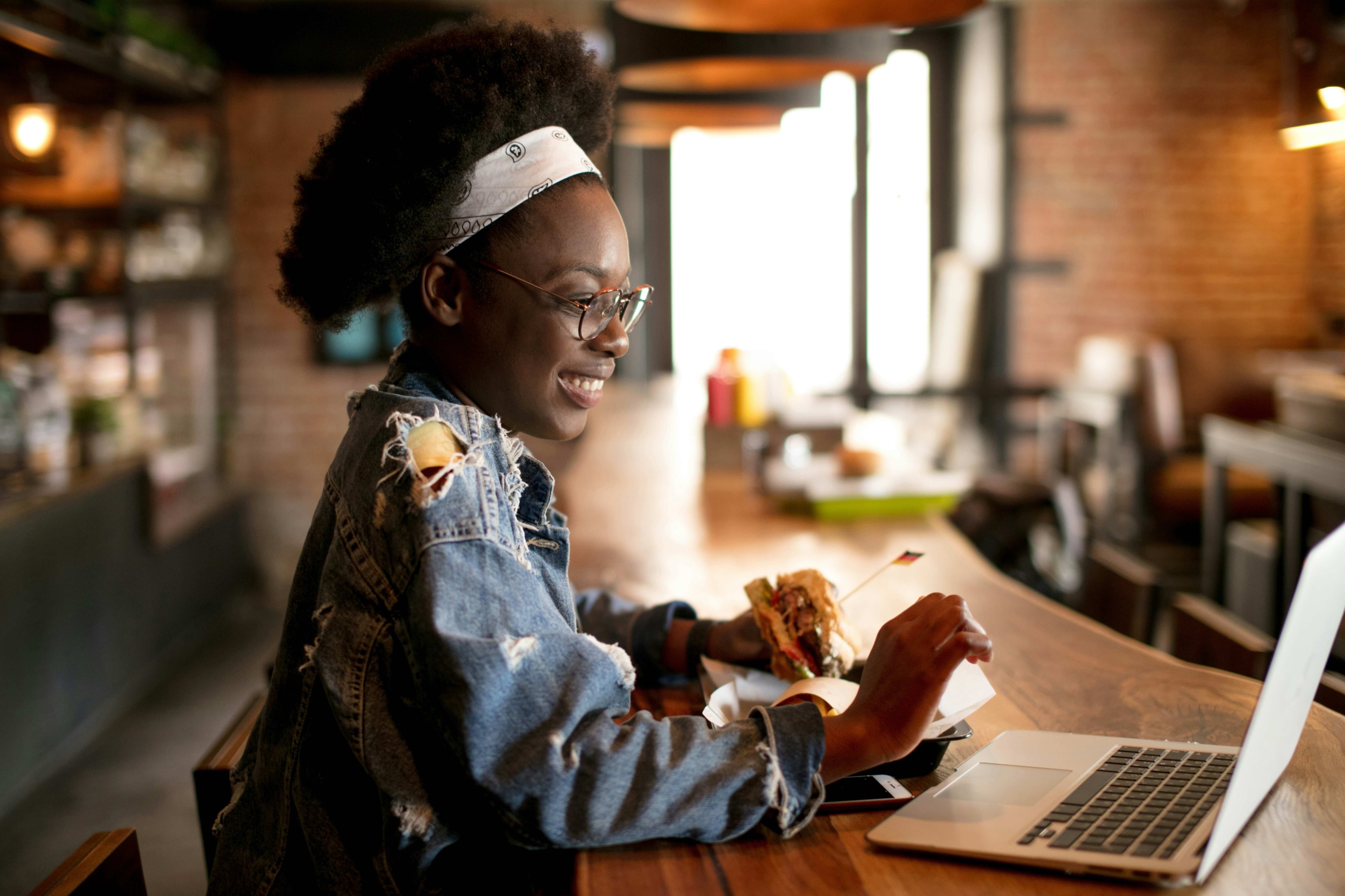 woman working on computer in restaurant
