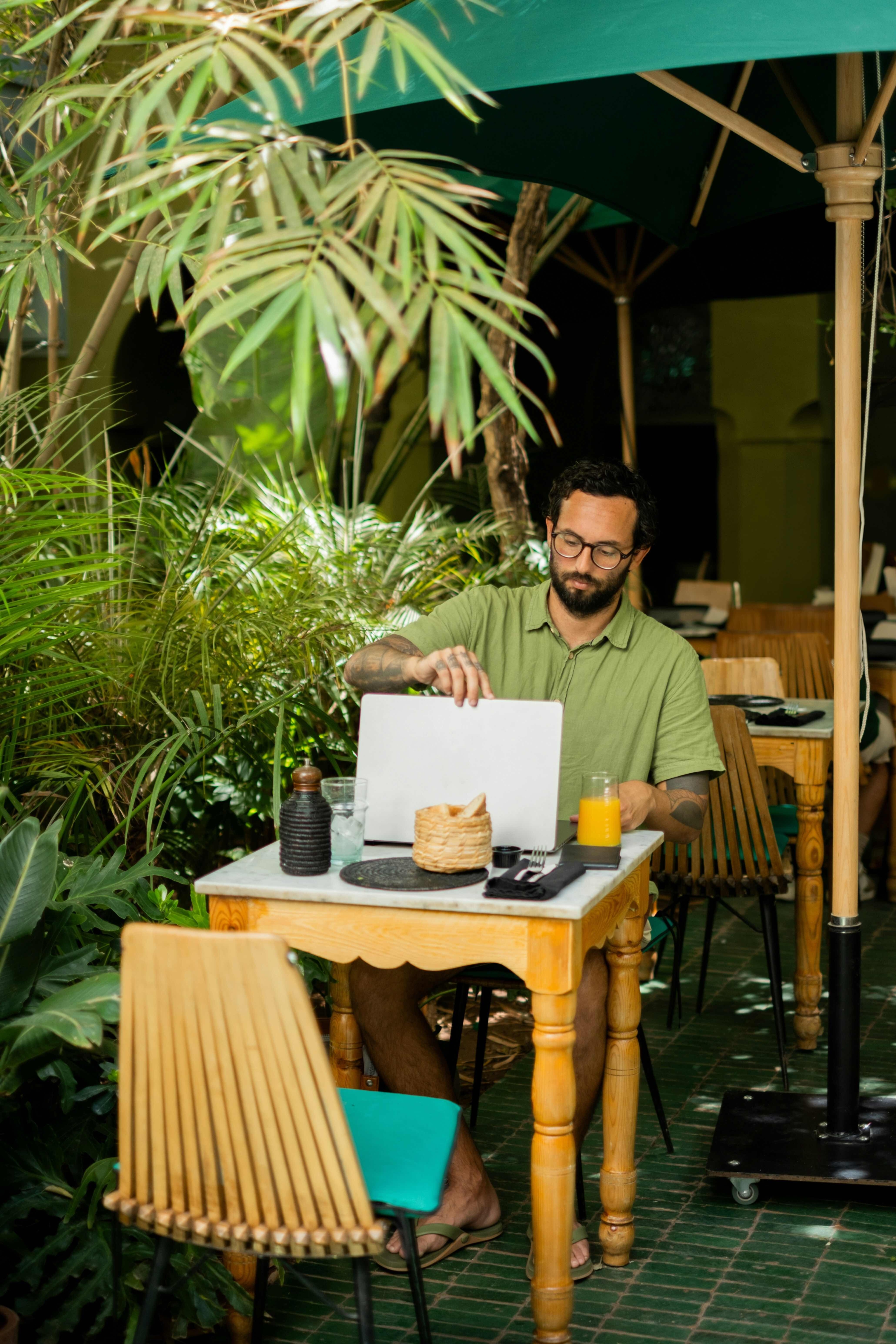 man with laptop at table