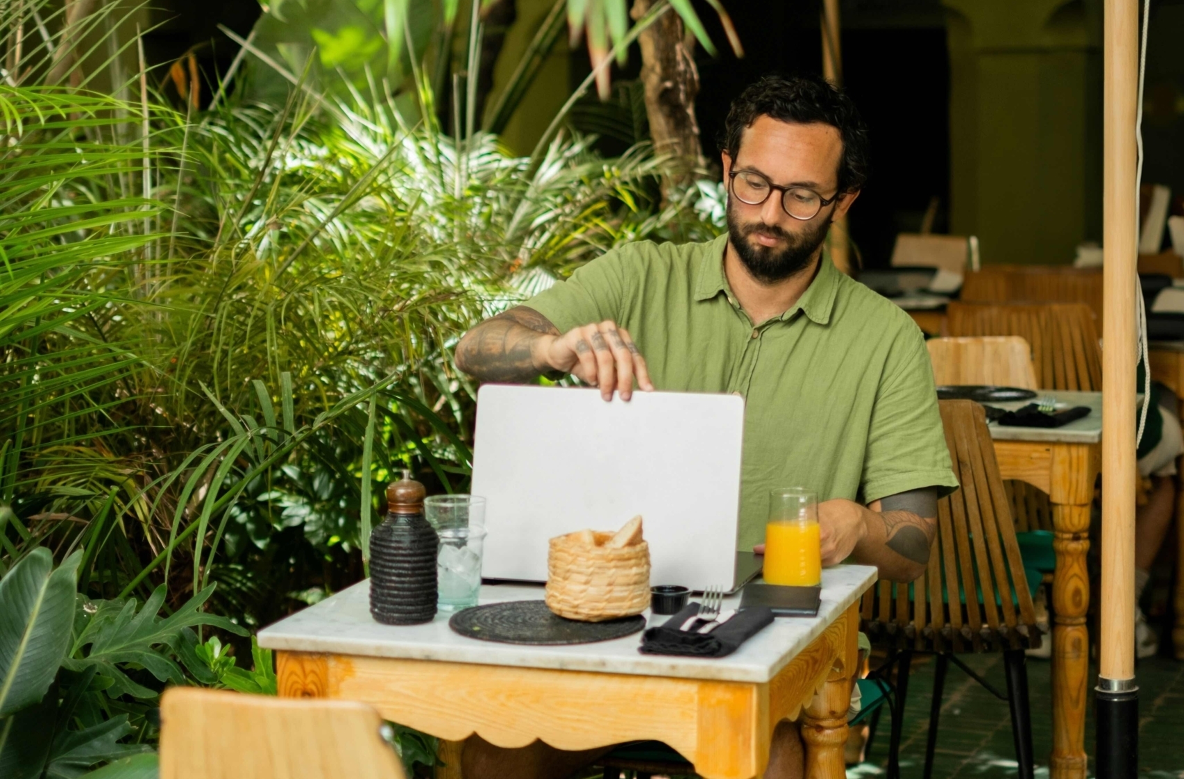 man with laptop at table