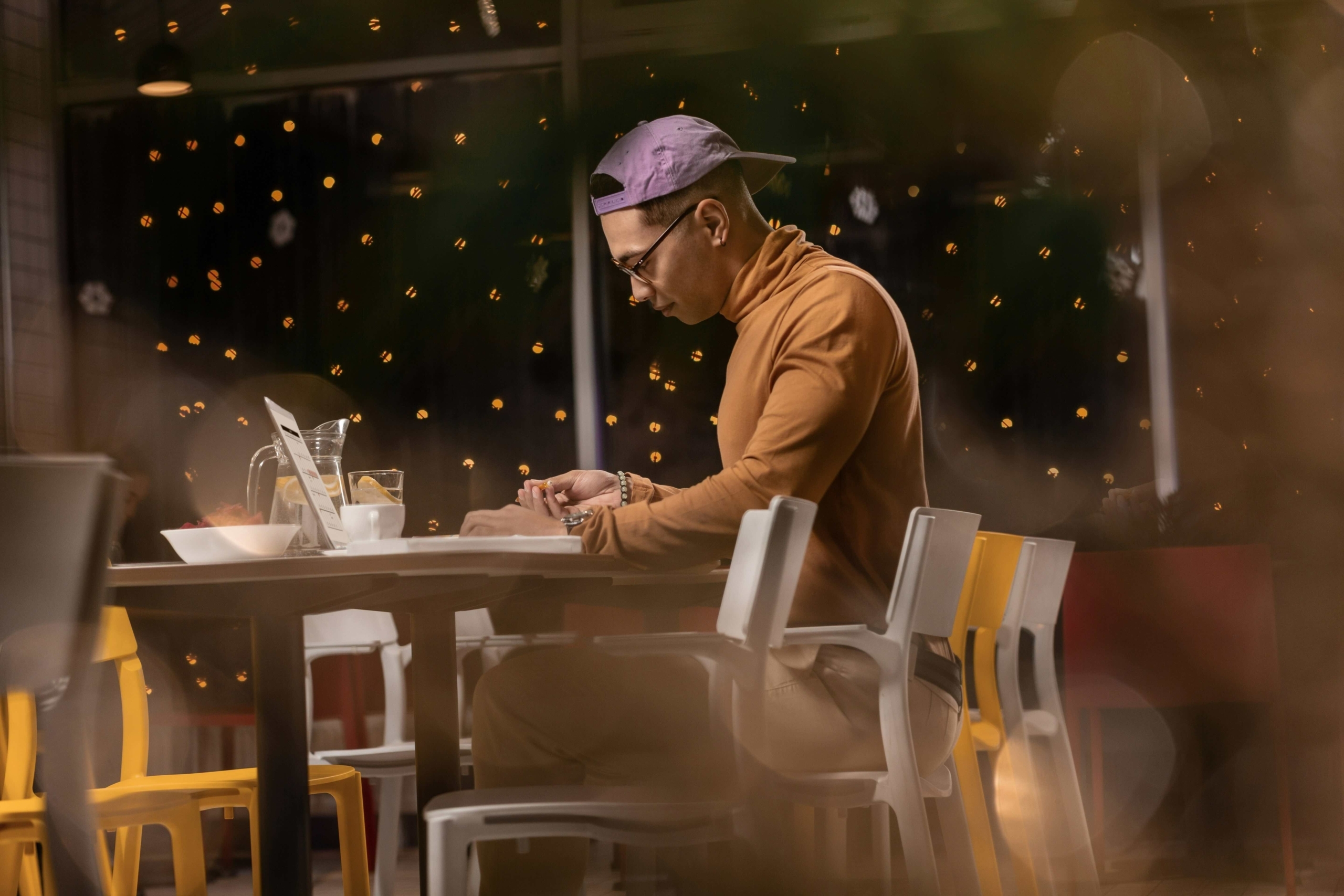 person working on laptop in restaurant