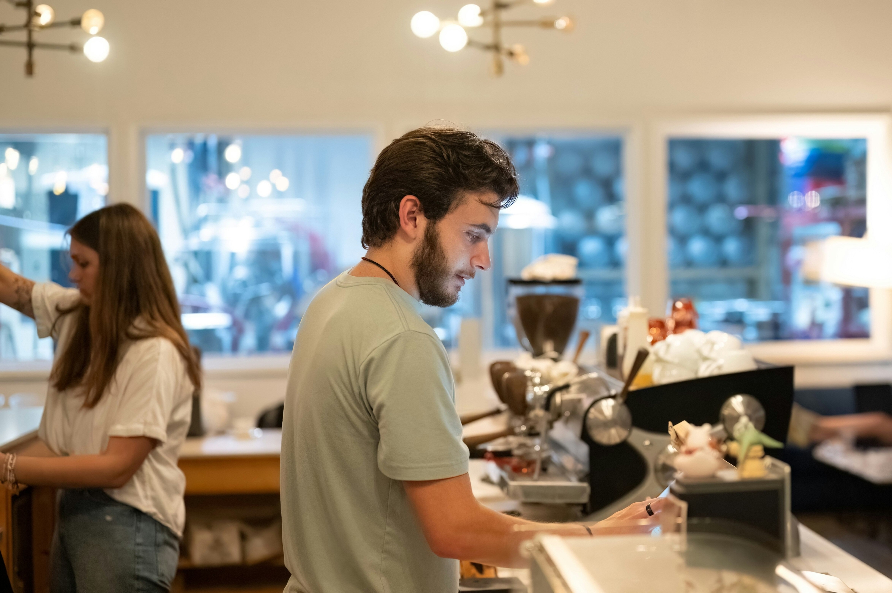photo of restaurant staff working till