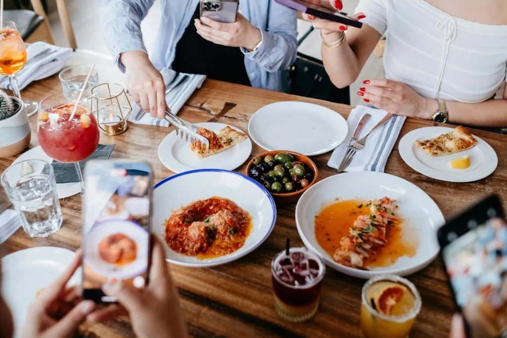close up of restaurant table full of food