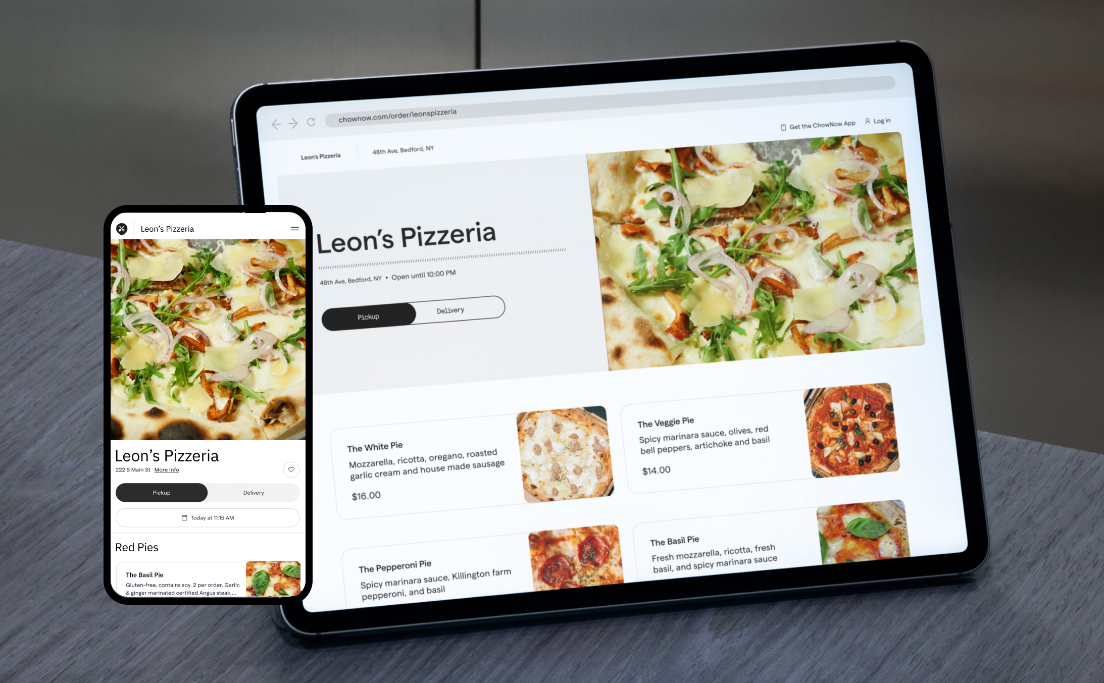 A tablet and mobile phone. On the screens are the same restaurant's direct online ordering platform from the two views. Shows the menu and options to order.