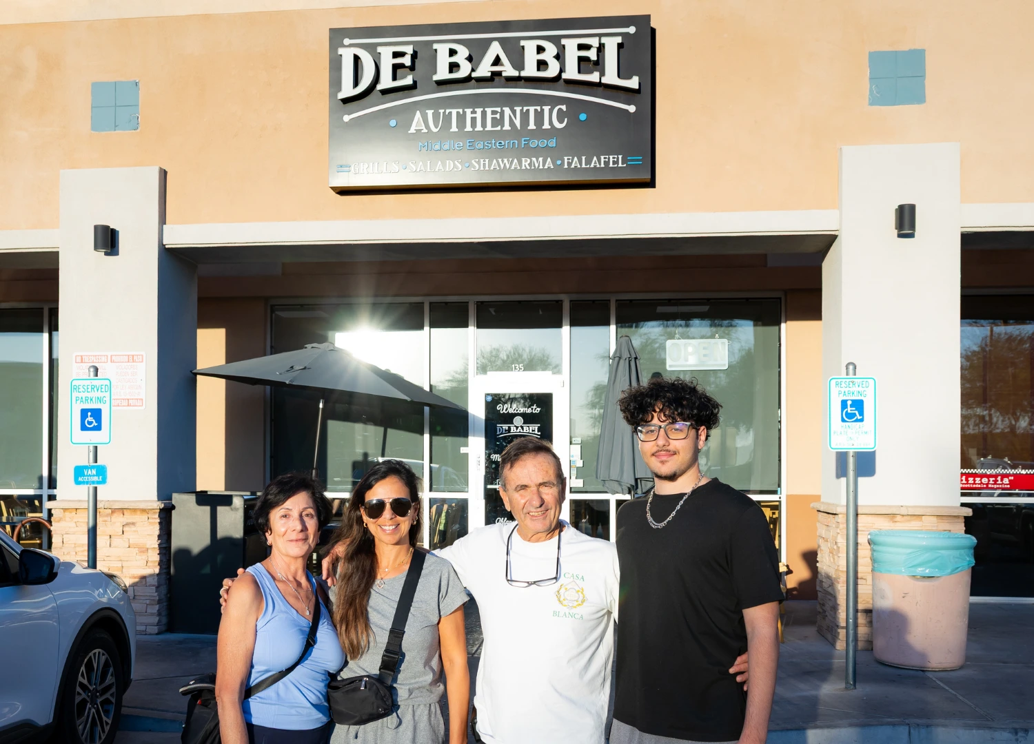 Marwan Kandeel and family in front of De Babel restaurant in Scottsdale, Arizona