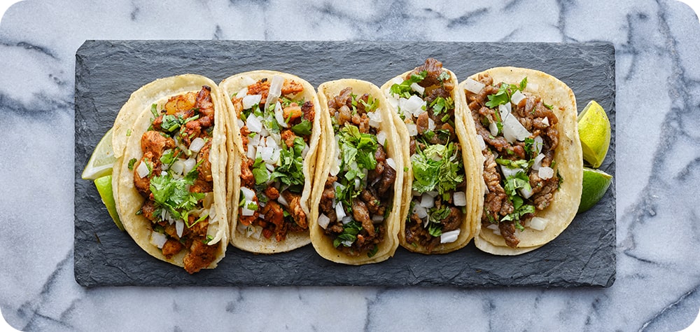 An overhead shot of tacos creates a realistic but pleasing image.